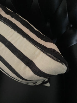 The edge of the Monochrome Striped Velvet Cushion Cover.