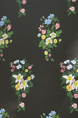 Close-up image of the JoJo & Trixie Floral New York Black Wallpaper