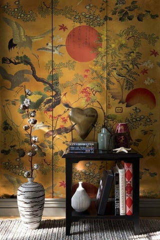 Lifestyle image of the metallic edition of the ByoBu wallpaper with a side table in front of it with black side table and large vases on floor