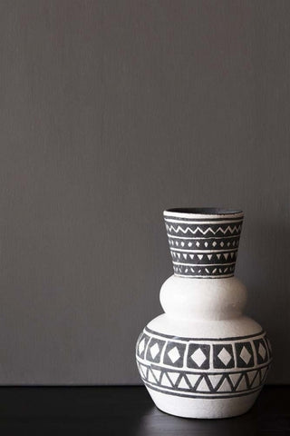 A bold modern monochrome vase photographed in front of a wall painted in Raeburn paint.