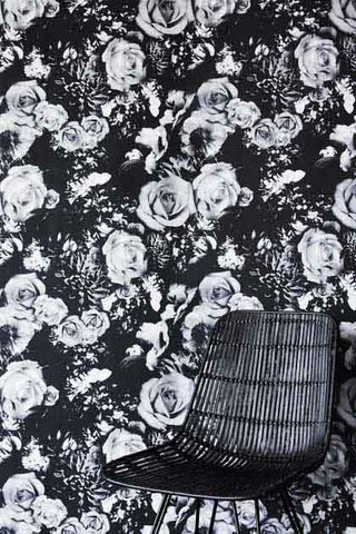 Rockett St George wallpaper. This paper features big black and white roses. Photographed with a black ratan chair. 
