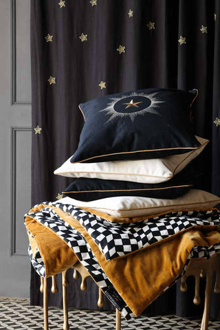 Image of the Black Star Embroidered Cushion with our 15 Year Anniversary Collection products