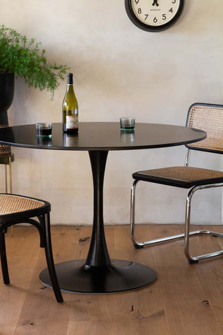 Lifestyle image of the 70's Inspired Black Round Dining Table