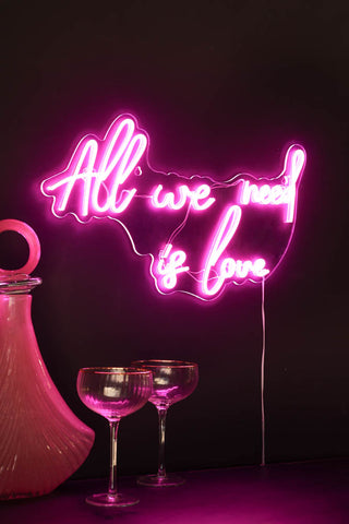 Lifestyle image of the All We Need Is Love LED Acrylic Neon Light