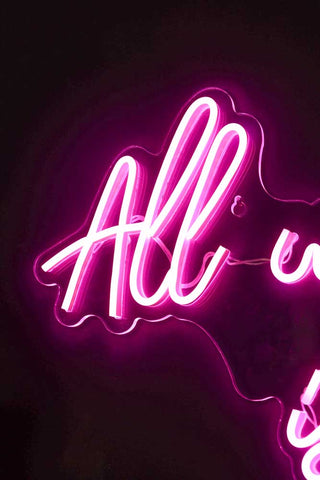 Close-up image of the All We Need Is Love LED Acrylic Neon Light