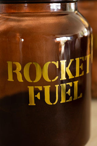 Close-up image of the Amber Glass Storage Jar With Black Lid - Rocket Fuel