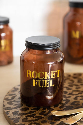 Lifestyle image of the Amber Glass Storage Jar With Black Lid - Rocket Fuel