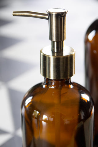 Image of the gold nozzle on the Amber Tinted Glass Soap Dispenser Bottle