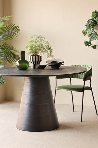 Lifestyle image of the Textured Black Round Dining Table