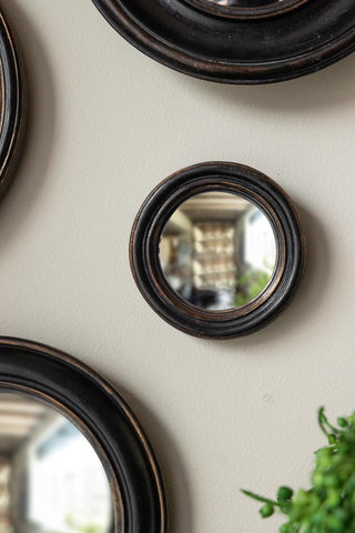 Close-up image of the Antique Black Thin Framed Extra Small Convex Mirror
