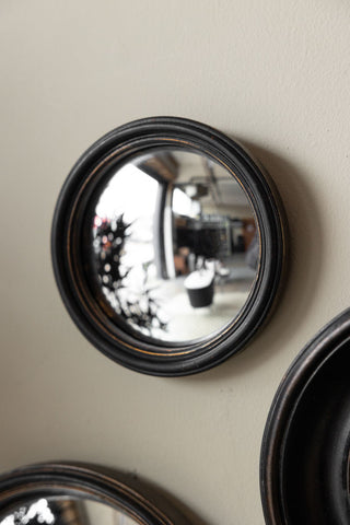 Lifestyle image of the Antique Black Thin Framed Small Convex Mirror