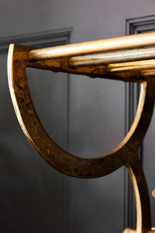 Image of the finish for the Antique Gold Luggage Rack With Coat Hooks