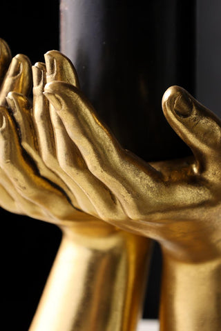 Close-up image of the Antique Gold Palm Hand Candle Holder