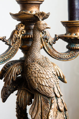 Close-up of the peacocks head on the Antique Gold Peacock Trio Candlestick Holder