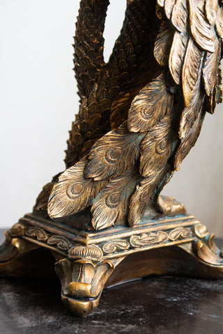 Close-up of the base on the Antique Gold Peacock Trio Candlestick Holder