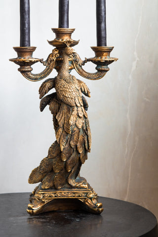 Image of the front of the Antique Gold Peacock Trio Candlestick Holder
