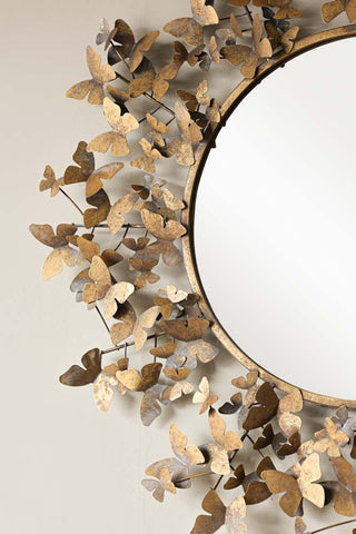 Close-up image of the Antiqued Butterflies Round Wall Mirror