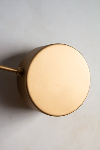 Close-up front on image of the discs on the end of the arms on the Art Deco Statement Wall Light