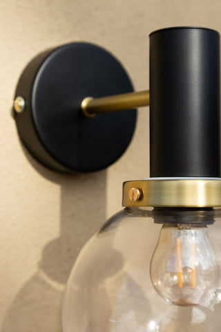 Close-up image of the Black & Brass Glass Outdoor Wall Light