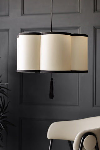 Lifestyle image of the Black & Cream Lantern Curved Ceiling Light Shade with the mink faux leather bar stool