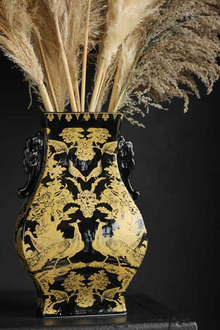 Image of the Black & Gold Chinoiserie Porcelain Vase with pampas grass in it