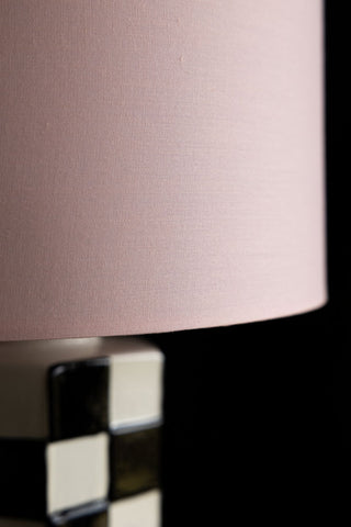 Close-up image of the Black & White Checkered Table Lamp With Pink Shade