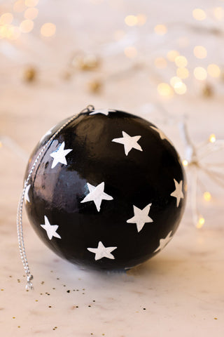Lifestyle image of the Black Christmas Decoration With White Stars