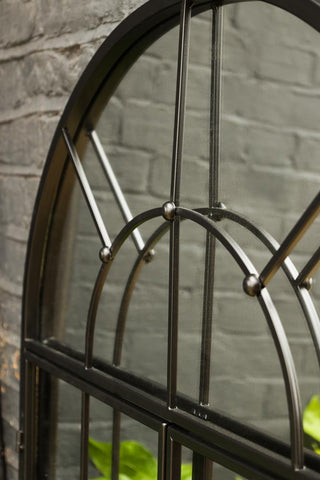 Image of the frame detail on the Black Metal Arch Window Pane Indoor/Outdoor Mirror With Opening Doors