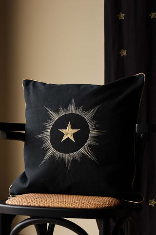 Lifestyle image of the Black Star Embroidered Cushion