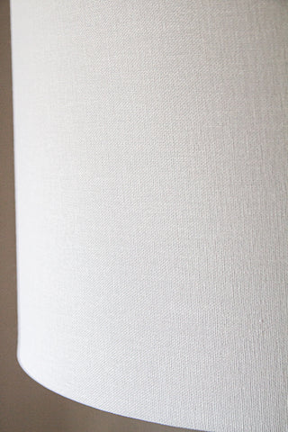 Close-up image of the linen lamp shade with the Black Turned Wood Table Lamp