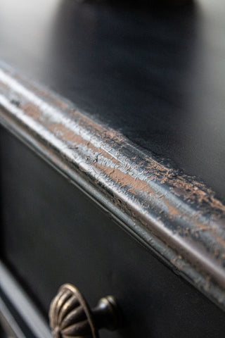 Close-up image of the top of the Black Vintage Style Metal Distressed Console Table With Drawer