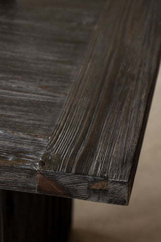Close-up image of the Black Wood Dining Table With Slatted Legs