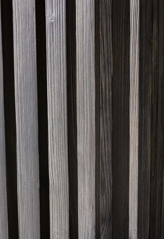 Detail image of the Black Wood Dining Table With Slatted Legs