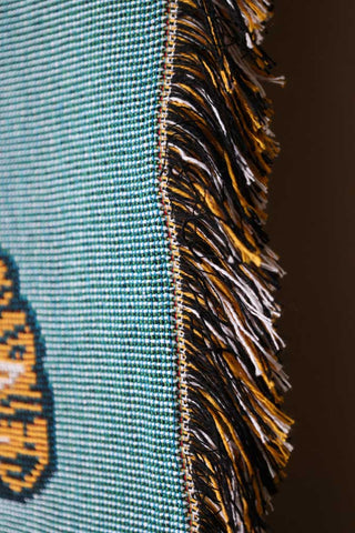 Image of the tassels on the side of the Denim & Bone Blue Loved Woven Cotton Throw