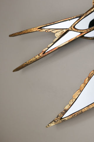 Image of the tips of the tail on the Brass & Mirror Swallow Wall Decoration