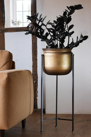 Lifestyle image of the Bronze Planter On Metal Stand