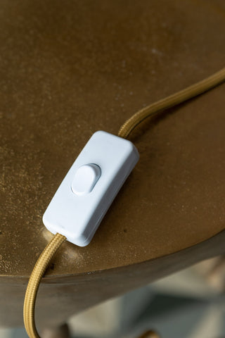Image of the switch for the Clam Gold Shell Table Lamp