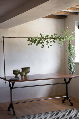 Lifestyle image of the Clamp-On Table Stand For Hanging Decorations Over Your Table