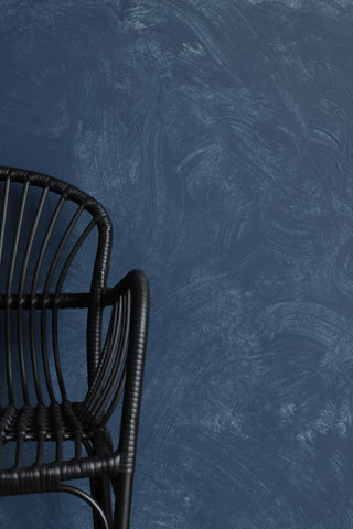 Image of the Craig & Rose Artisan Chalk Wash - Blue Ochre - 750ml and a chair