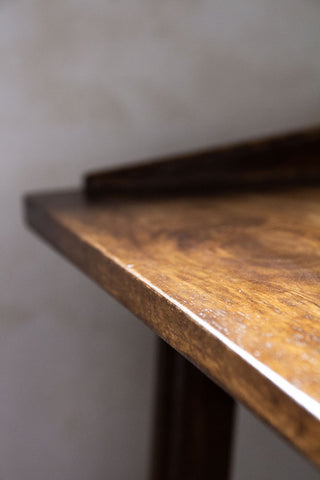 Close-up image of the top of the Dark Mango Wood Bedside Table With Cable Gap