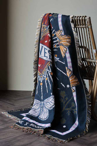 Image of the Denim & Bone Midnight Blue Loved Woven Cotton Throw draped over a chair