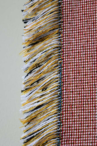 Image of the tassels on the Denim & Bone Pink Loved Woven Cotton Throw