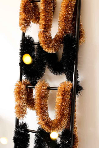 Image of the Eco-Friendly Recycled Black Tinsel  with the Eco-Friendly Recycled Metallic Gold Tinsel