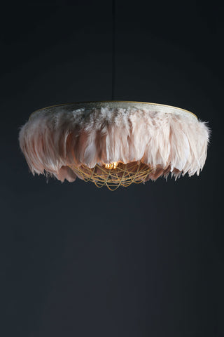 Image of the Juliette Fabulous Feather Chandelier Featuring Chains in Blush Pink on a dark background