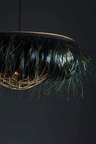 Close-up image of the Juliette Fabulous Feather Chandelier Featuring Chains in Iridescent Black/ Electric Peacock