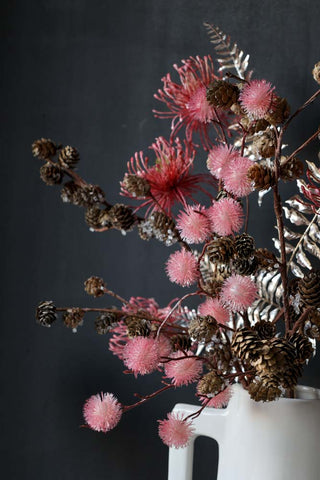 Close-up image of the arrangement featuring the Faux Pinecone Branch Stem