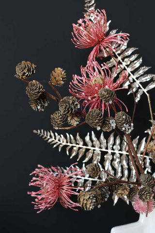 Image of the Faux Pinecone Branch Stem with the faux exotic flower stem and the silver fern leaf stem
