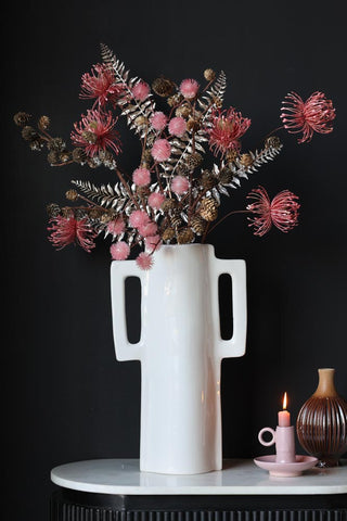Lifestyle image of an arrangement featuring the Faux Pinecone Branch Stem
