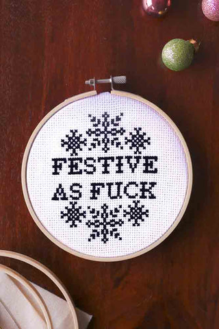 Lifestyle image of the Festive As Fuck Cross Stitch Kit