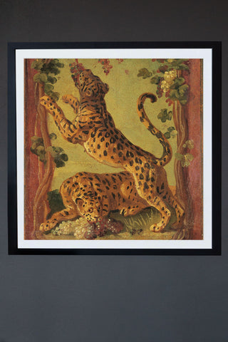 Image of the Framed Leopard Love Art Print hanging on the wall